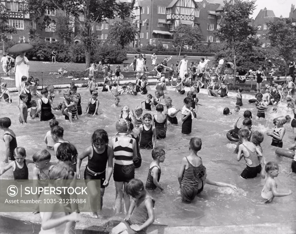 Chicago, Illinois:  July 21, 1930 Children in the kiddie pool trying to beat the heat.