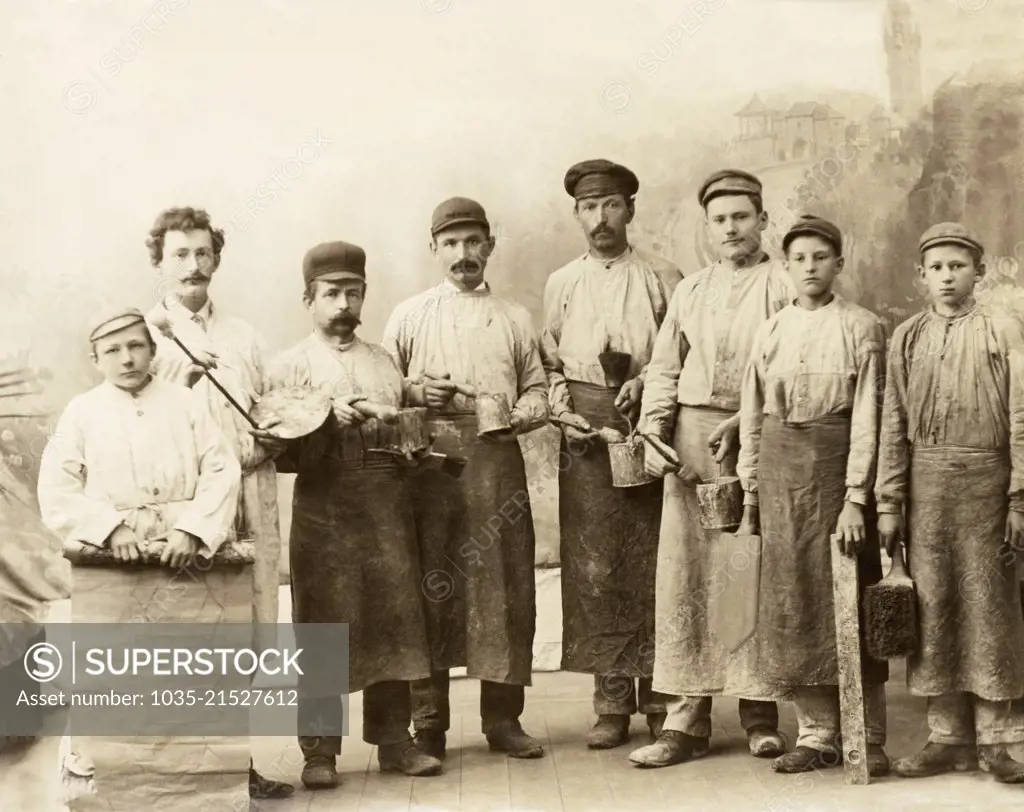 Germany:  c. 1880 An albumen print of a group of wall paper hangers and their tools of the trade. The back is captioned, "In our younger days".