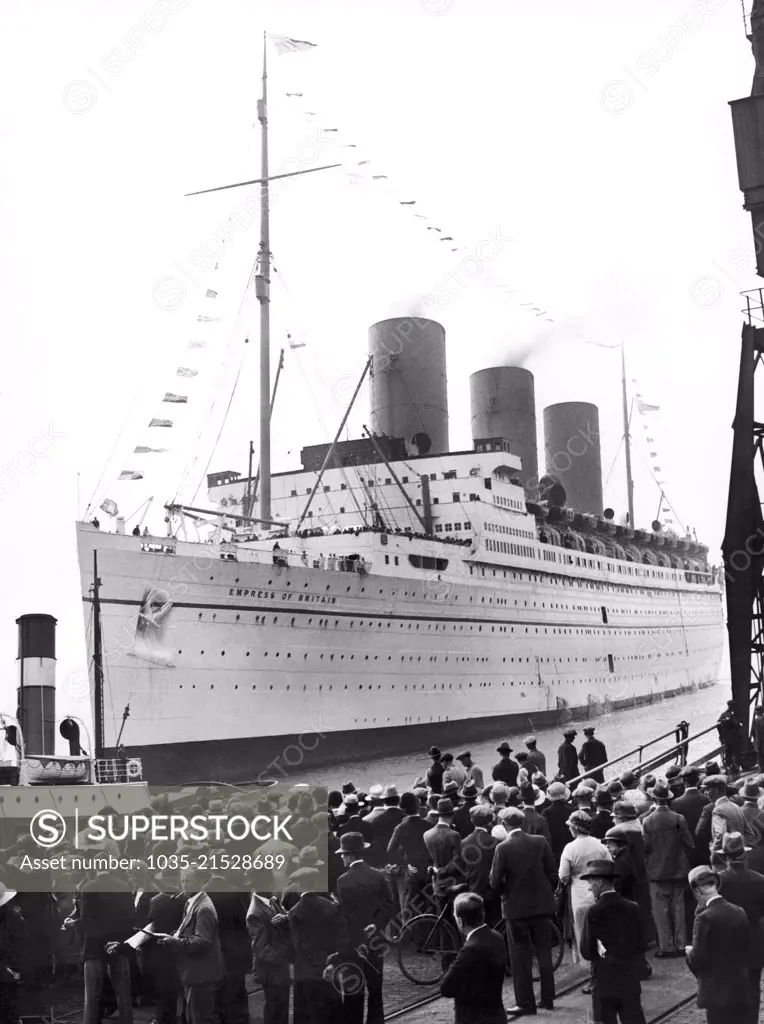 Southhampton, England:  August 26, 1932 Crowds wating at dockside as the "Empress of Britain" arrives with the Ottawa Conference delegates on board.