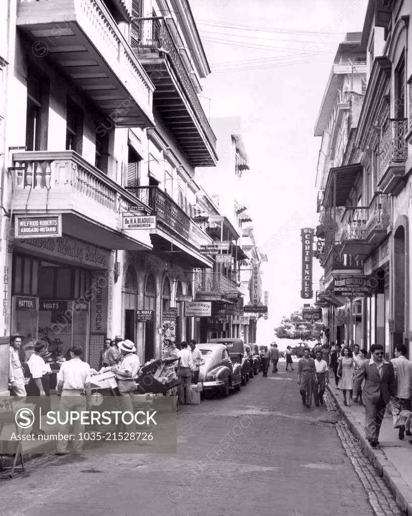 San Juan, Puerto Rico:  October 18, 1946 A street scene in Old San Juan. The cobblestones along the curbs were brought over centuries ago as ballast in the ships of the Conquistadores.