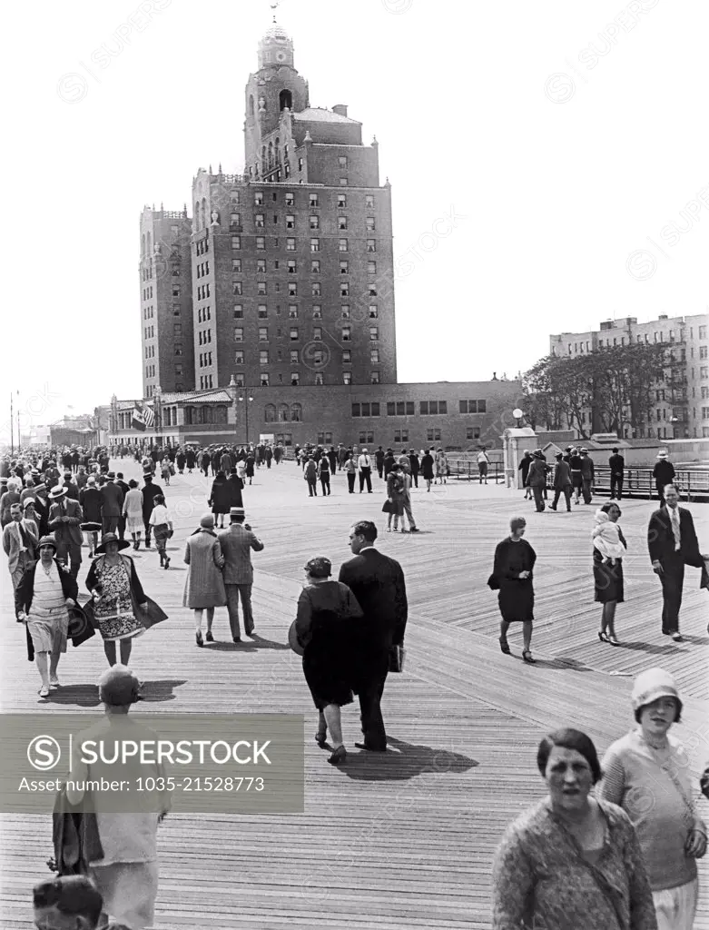 New York, New York:  c. 1927 People on the boardwalk approaching the new Half Moon Hotel at Coney Island in Brooklyn.