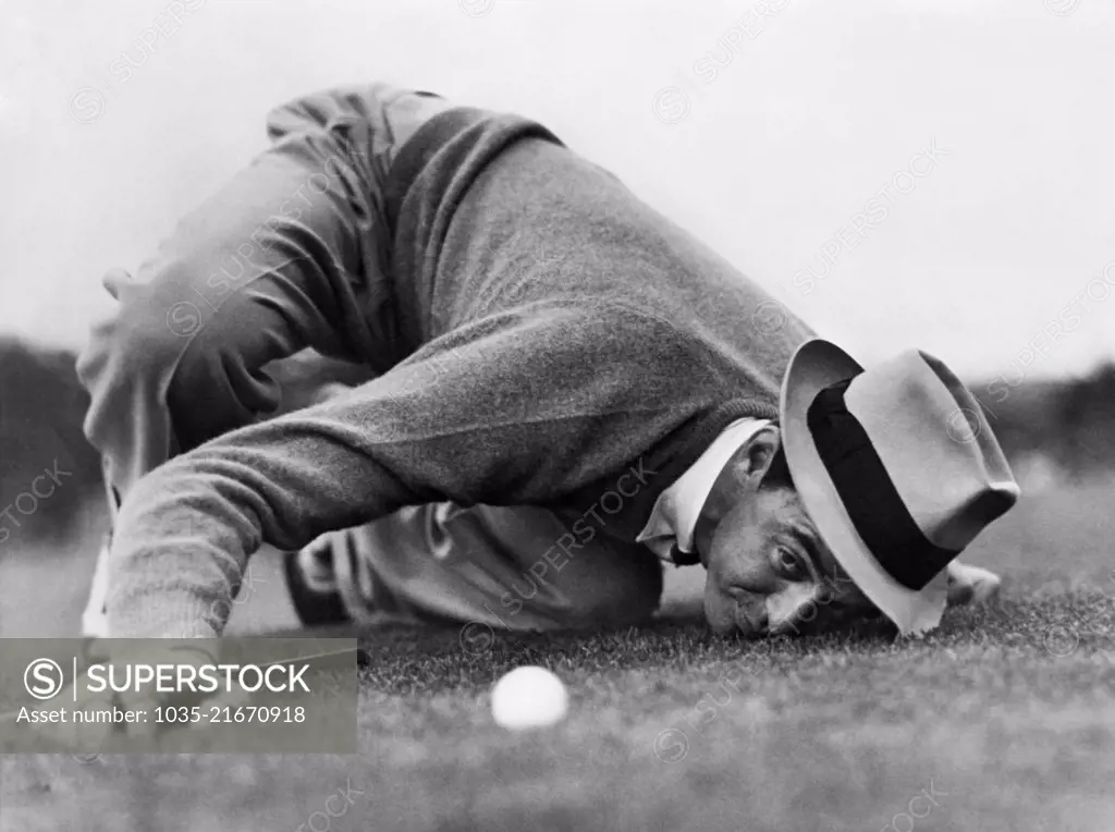 Augusta, Georgia: 1939 Professional golfer Sam Snead lines up a putt during the Masters Tournament, but lost in the final round to Ralph Guldahl.