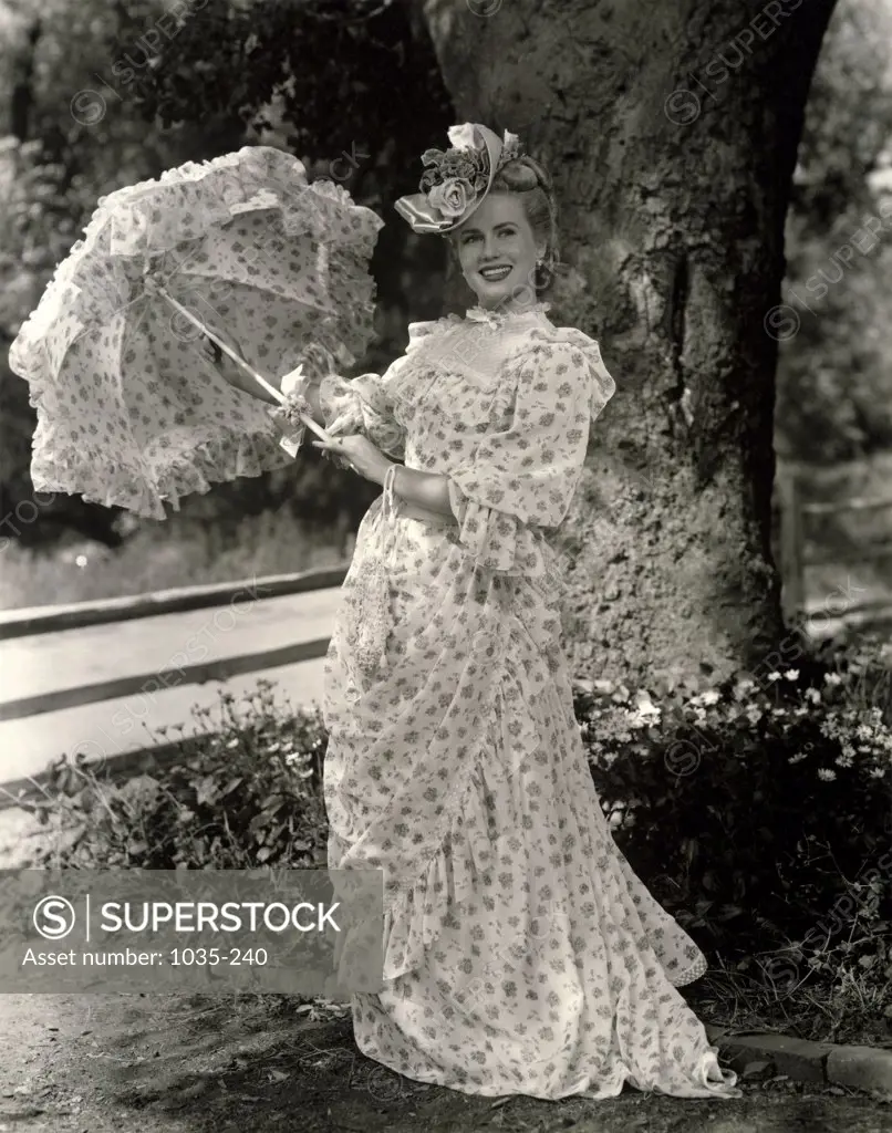 Young woman holding a parasol