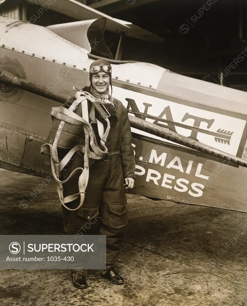 Portrait of a young man standing near an aircraft, 1929