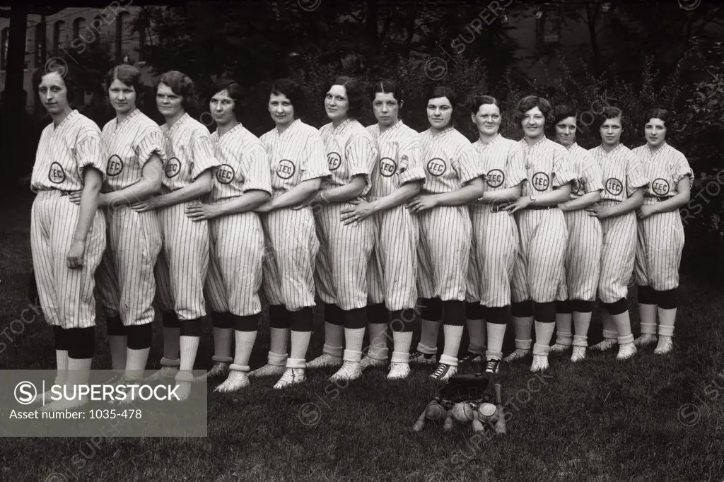 Portrait of a group of female baseball players smiling