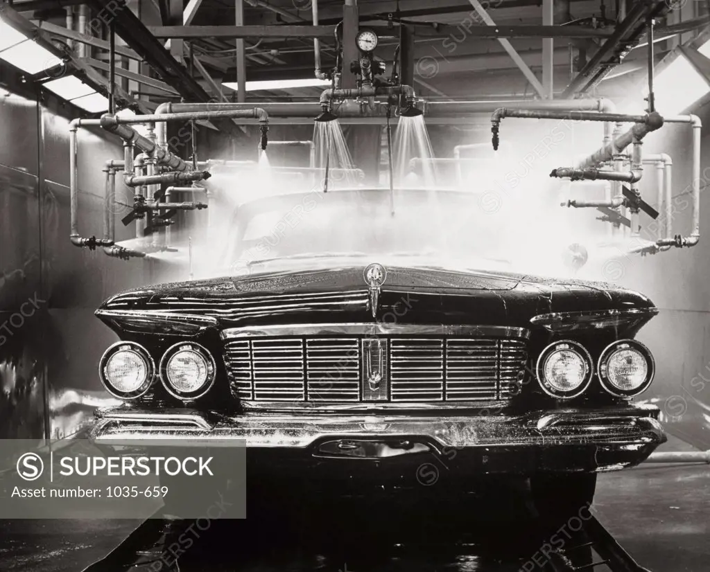 Quality control water test of a new car at an assembly line, 1963