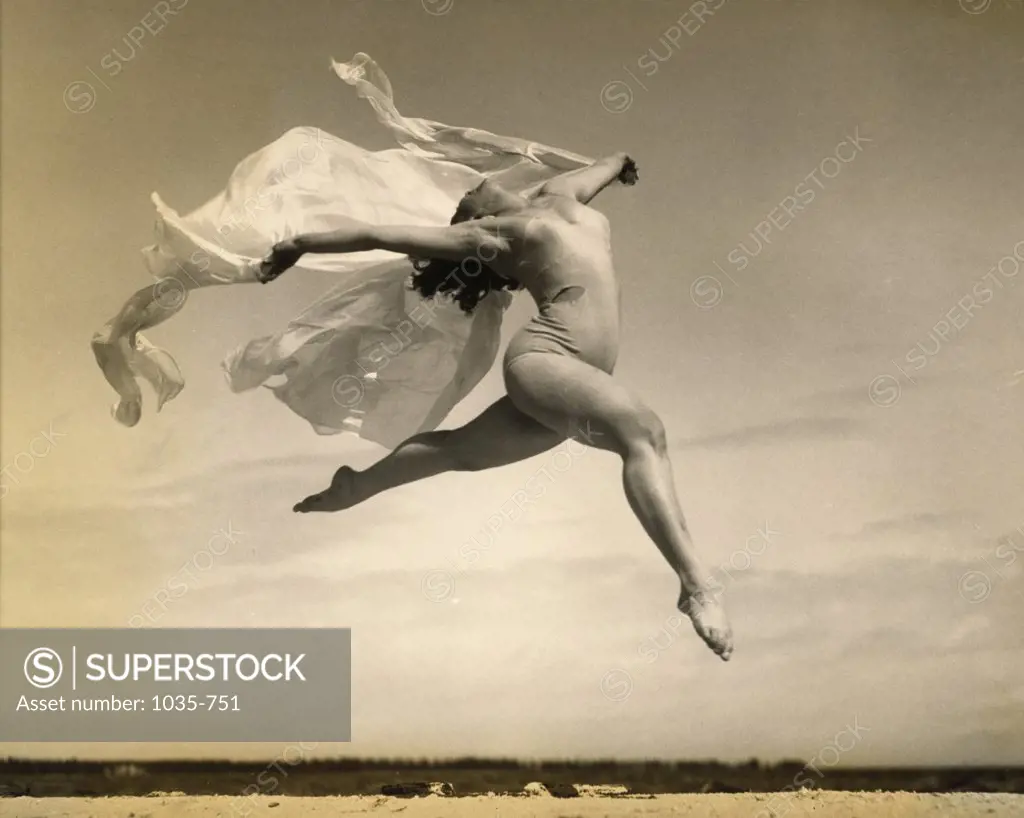 Young woman leaping
