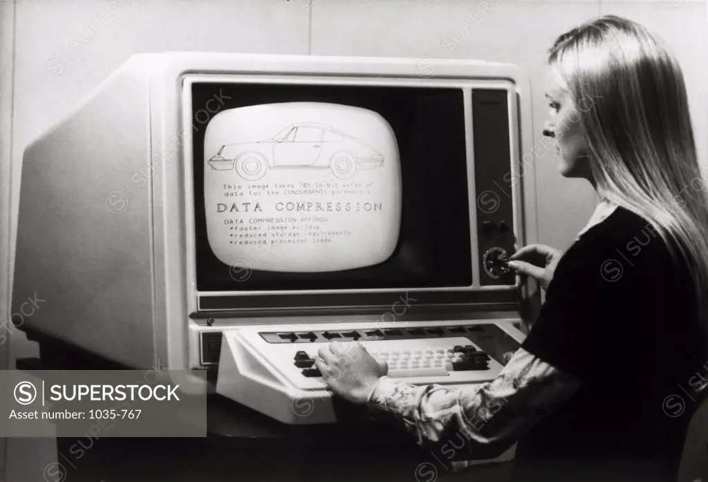 Side profile of a businesswoman working on a computer, Conographic-9 Terminal, 1975
