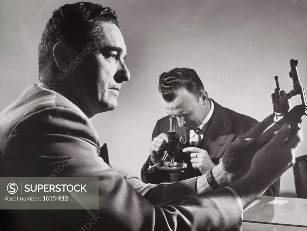 Close-up of two male scientists researching in a laboratory