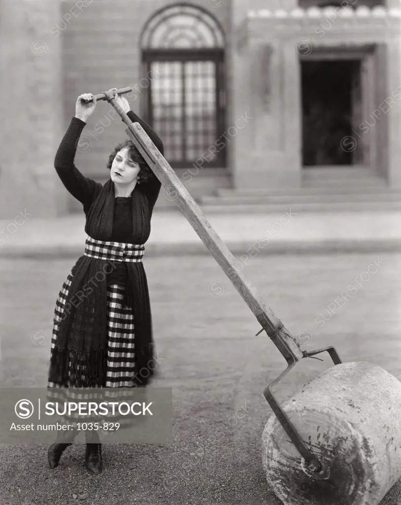 Young woman pushing a roller