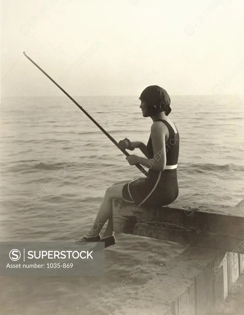 Side profile of a young woman fishing