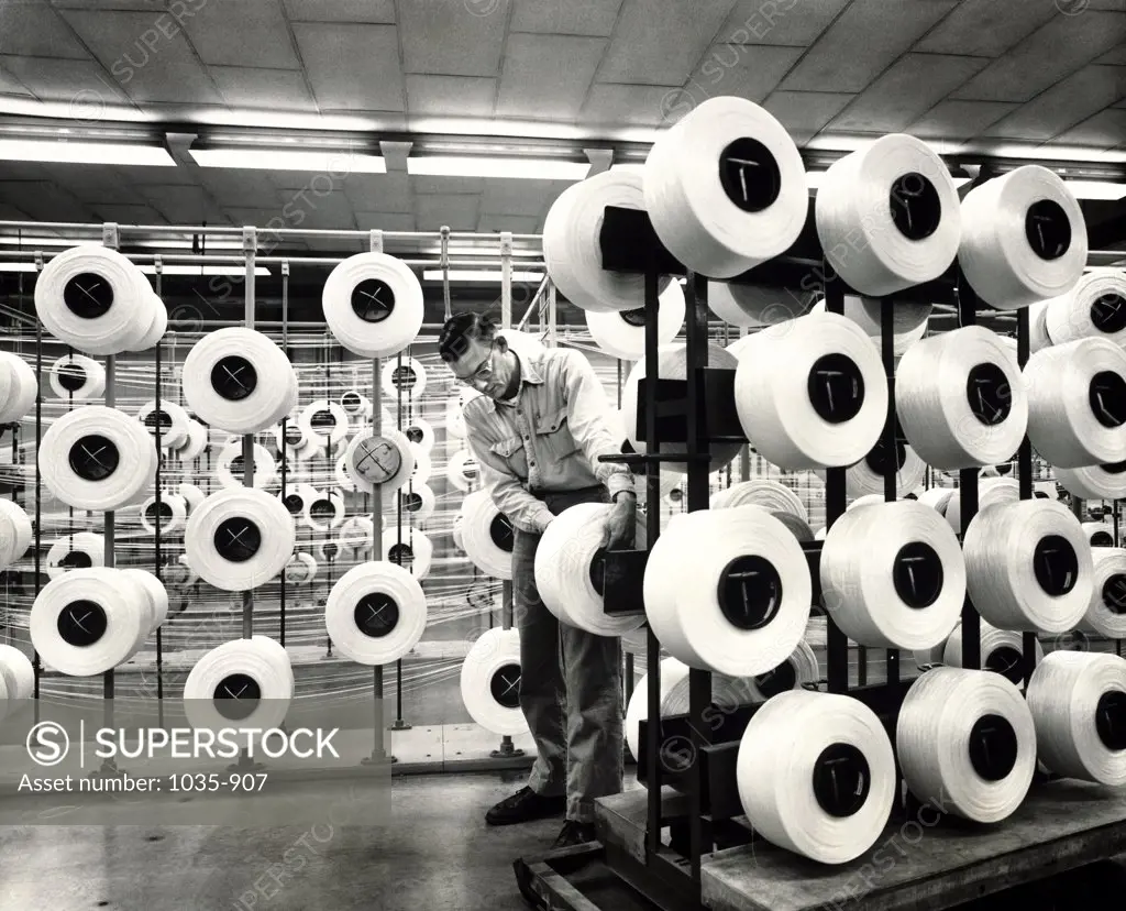 Mid adult man working in a textile factory, Allied Chemical, Chesterfield, Virginia, USA