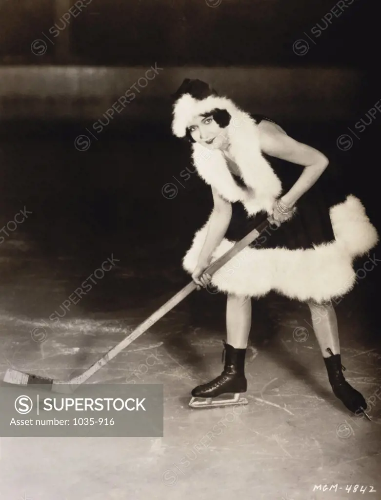 Portrait of a young woman playing ice hockey