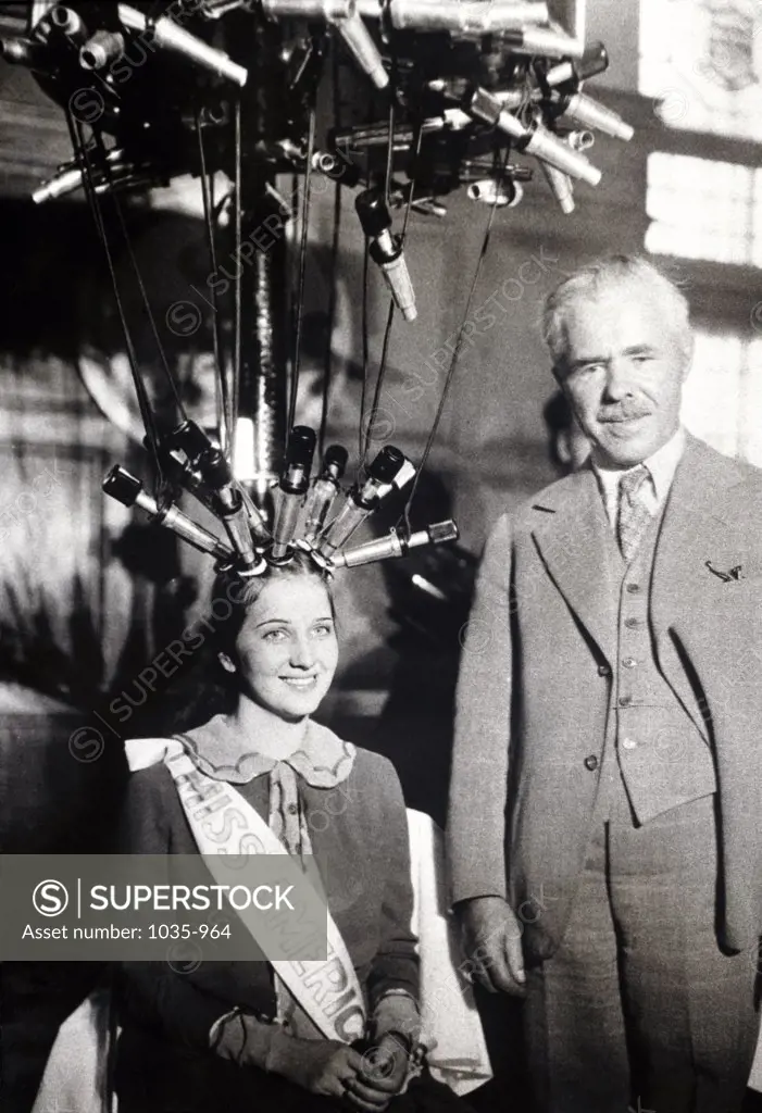 Portrait of a mature man standing with Miss America, 1926
