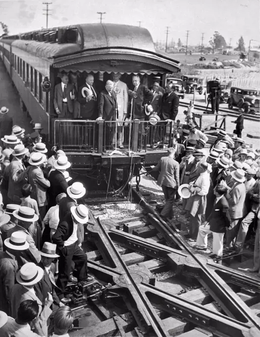 Los Angeles, California:  c. 1928. The unveiling of the 'continous rail' crossing in Los Angeles, which is a noiceless turntable to provide a continous rail at railroad crossings. It is called the greatest achievement in railroading since the invention of the block signal. It was secretly tested in LA for six months.