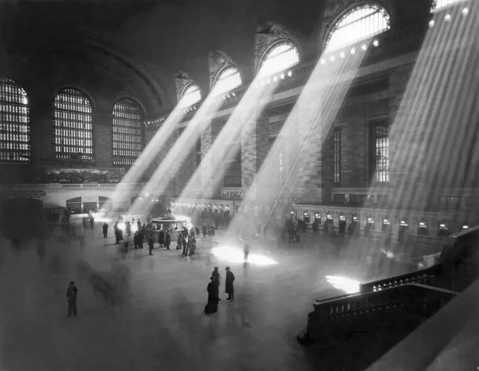 New York, New York:  c. 1940's. An interior shot of the Grand Central Railroad Station, with sunlight streaming in through the clerestory windows above.