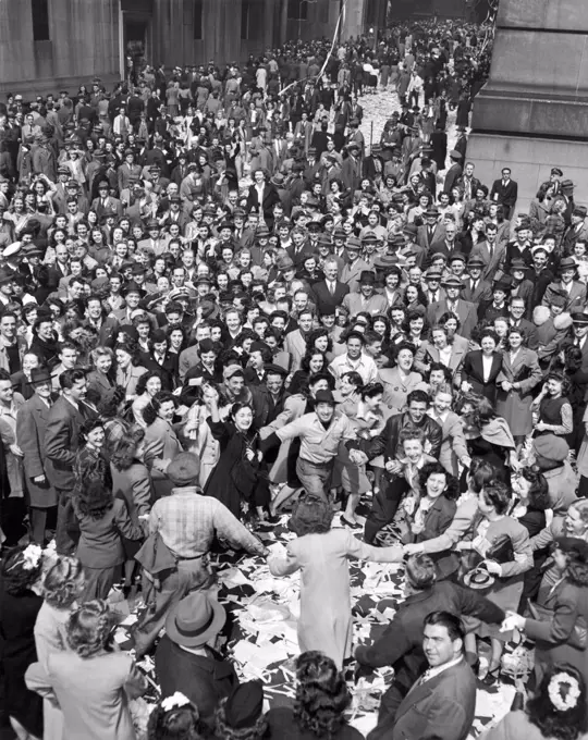 New York, New York:   May 7, 1945. An erroneous Associated Press announcement has New Yorkers celebrating VE-Day and dancing on Wall Street. The actual the end of WWII in Europe was not til the next day, May 8th.