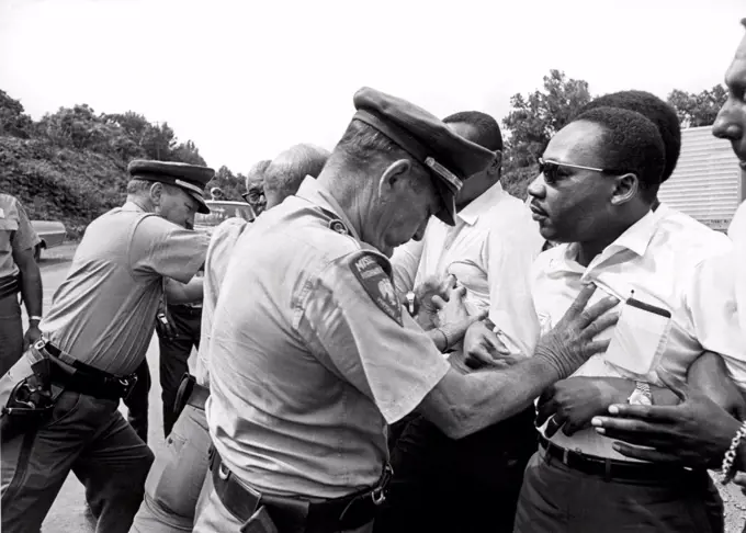Mississippi:  June 8, 1966.  Martin Luther King being shoved back by Mississippi patrolmen during the 220 mile 'March Against Fear' from Memphis, Tennessee to Jackson, Mississippi.
