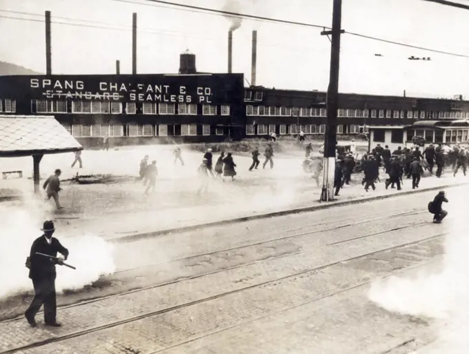 Ambridge, Pennsylvania:  June 11, 1934 Bullets and tear gas are being used against striking workers of the Spang Chalfant Company.