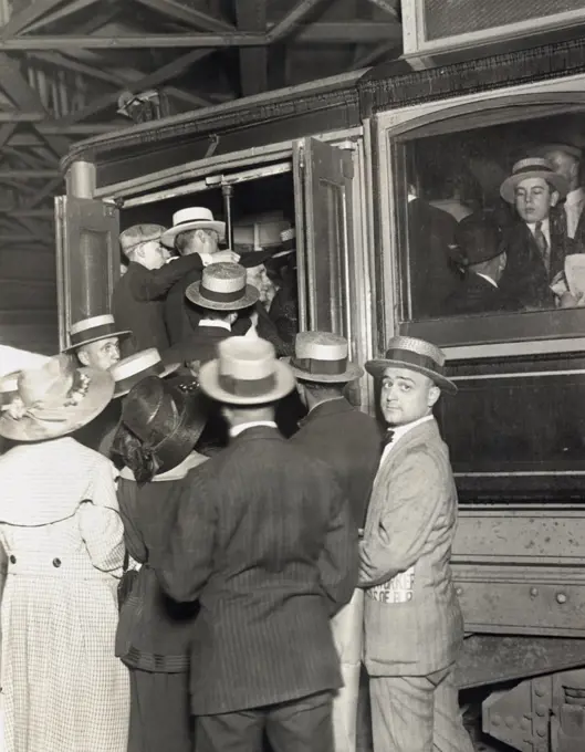 New York, New York:   August 7, 1919 Street car employees on strike against the Brooklyn Rapid Transit have tied up the transportation system with their protests. Here are people trying to board one of the few cars left in operation.