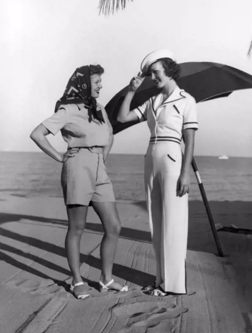 Miami Beach, Florida:   c. 1937 Two women at the Surf Club model the latest in beach bathing wear.