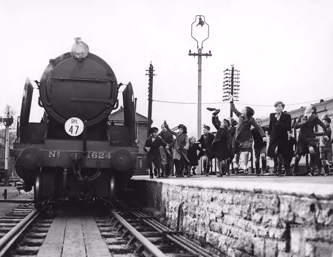 Yeovil, England:  December 3, 1939 Children who were evacuated from London during WWII excitedly greet the Southern Railway Evacuation Special train as it pullls in with their parents and relatives for a visit.