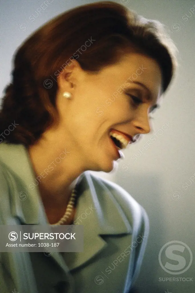 Side profile of a businesswoman smiling