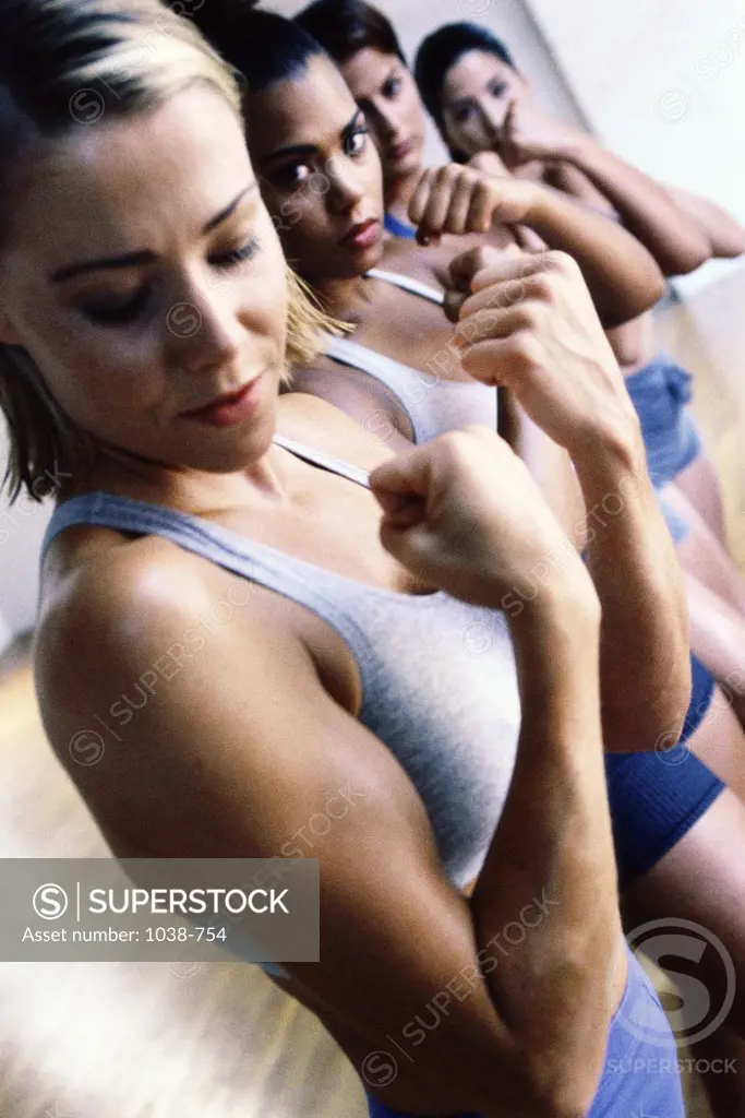 Group of young women exercising in a gym
