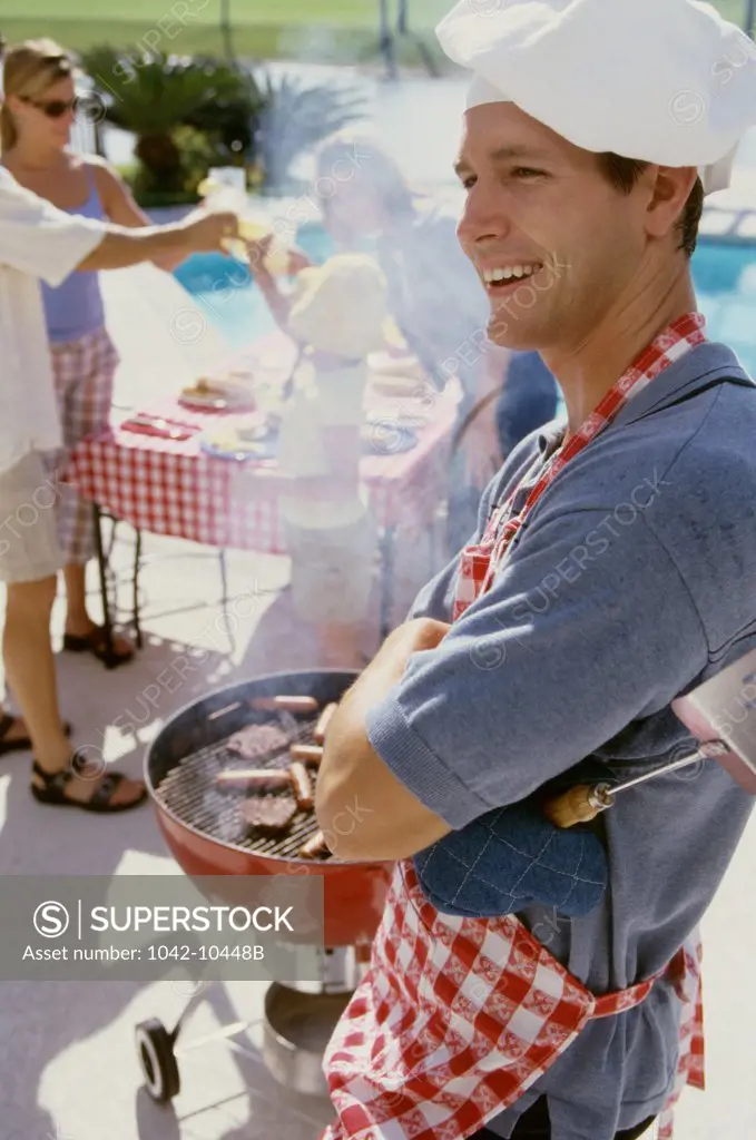 Young man at a barbecue