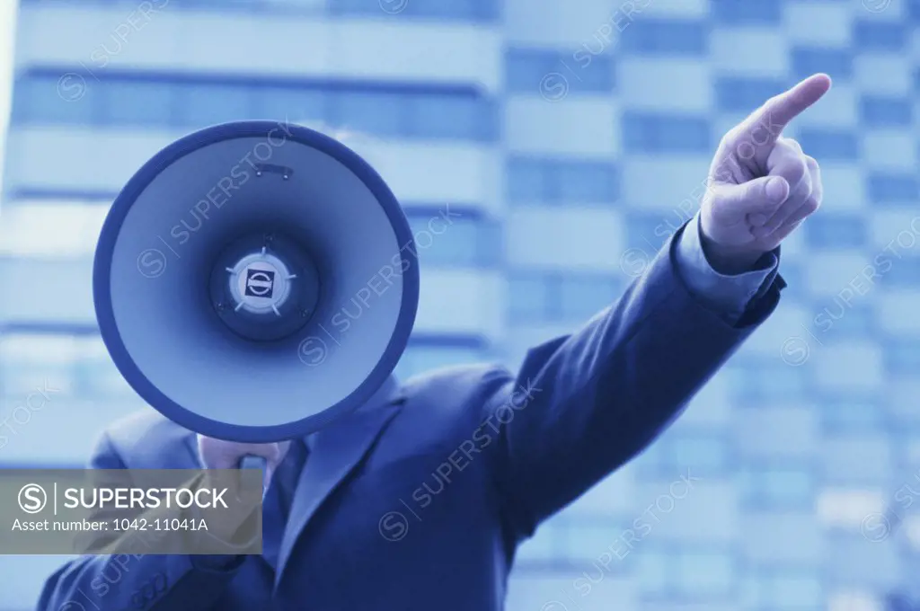 Businessman holding a megaphone