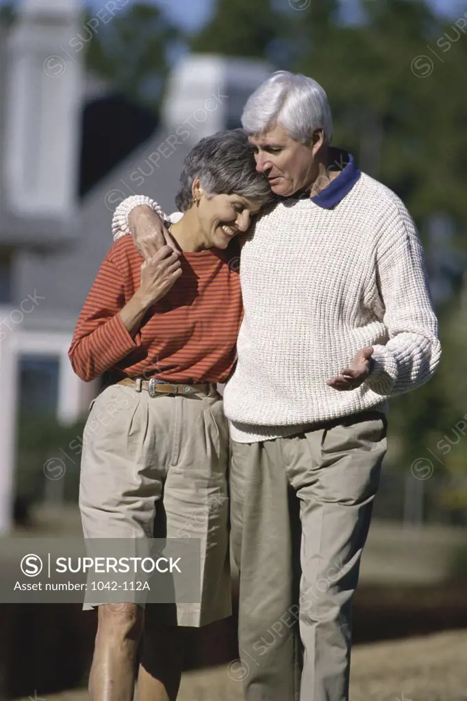 Mature couple holding each other