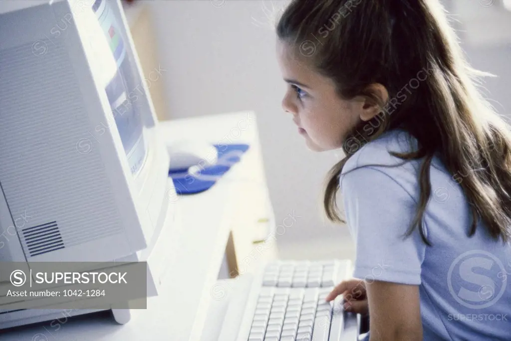 Side profile of a girl using a computer