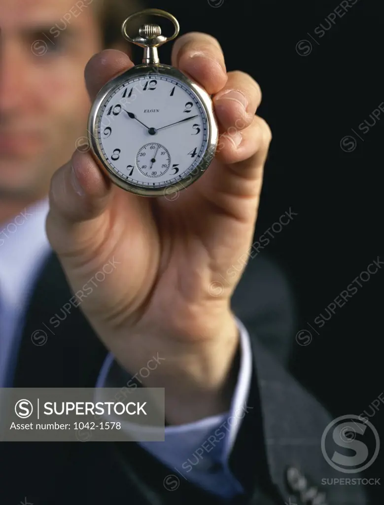 Businessman Holding Stopwatch