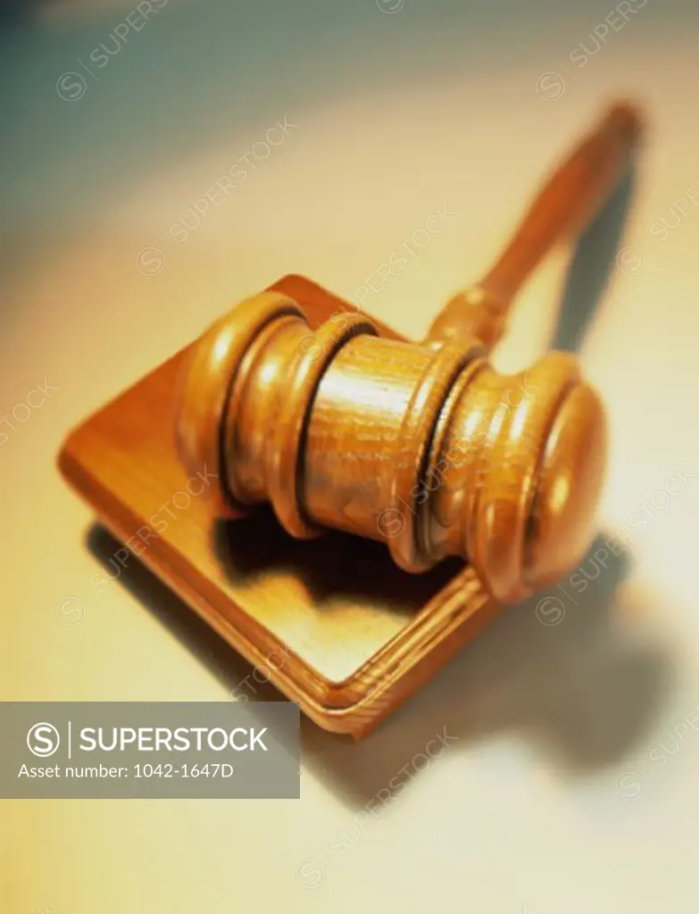 Close-up of a gavel and a block of wood