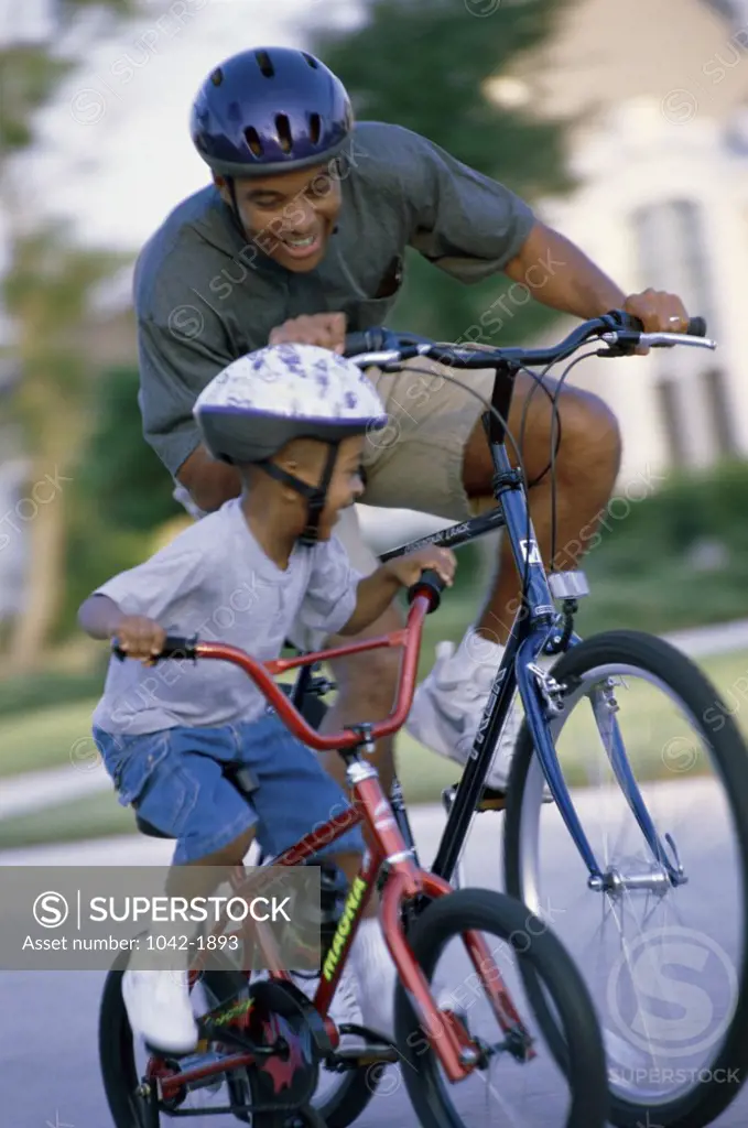 Father and his son riding a bicycle