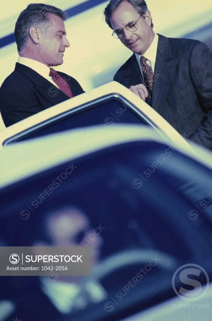 Two businessmen discussing