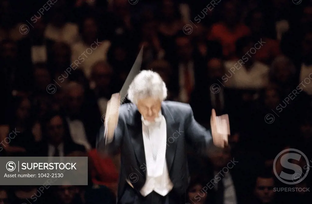 Conductor leading a symphony orchestra