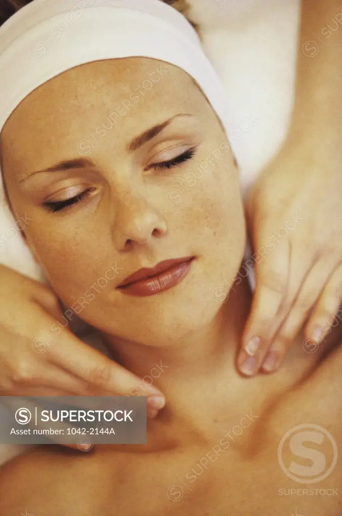 High angle view of a young woman getting a shoulder massage