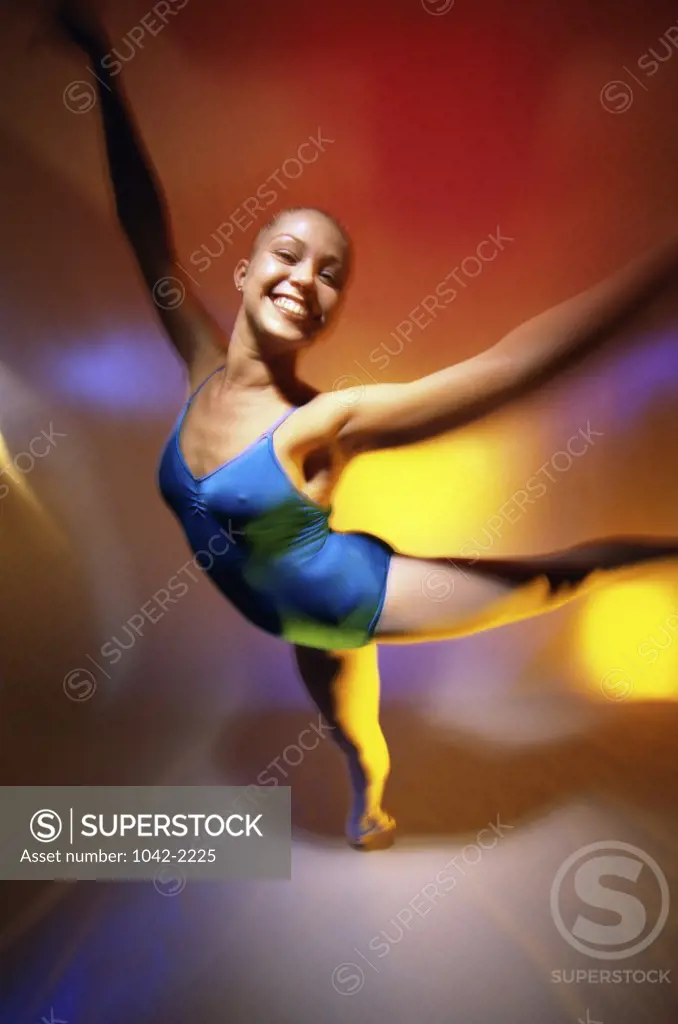 Portrait of a ballerina dancing on one leg