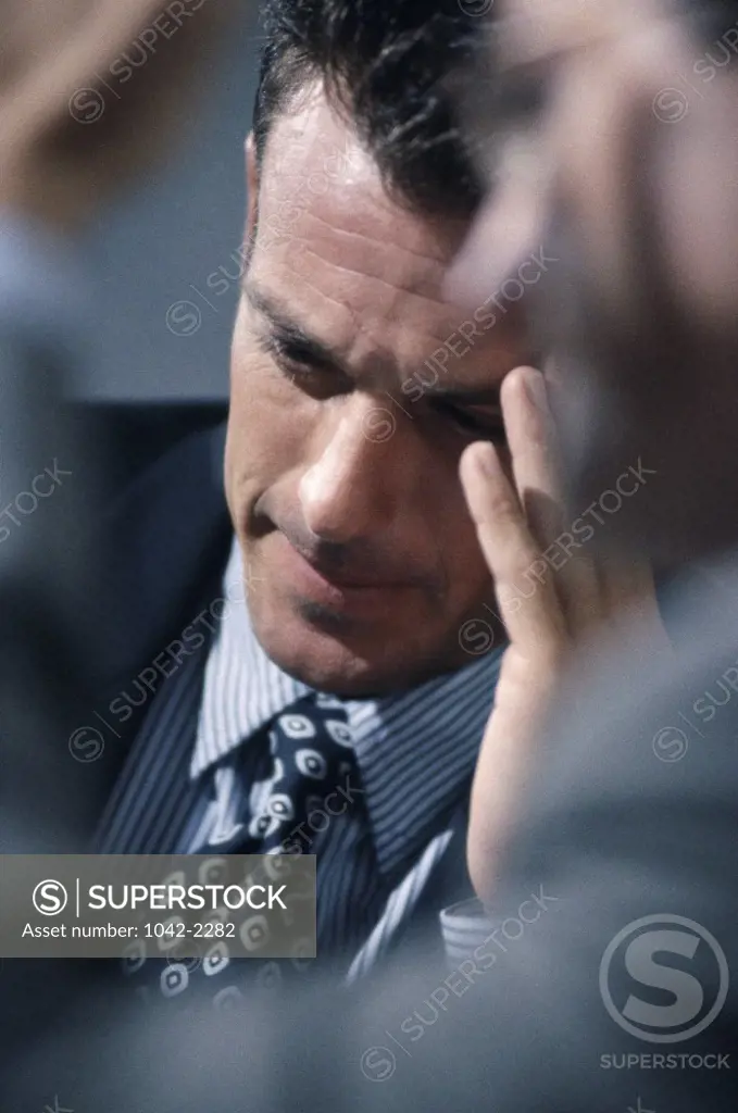 Businessman with his hand on his head