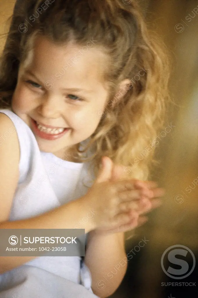 Girl clapping her hands