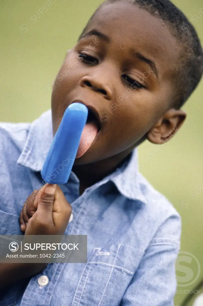 Close-up of a boy eating ice cream
