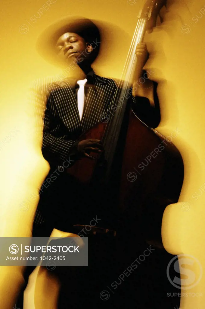 Young man playing the double bass