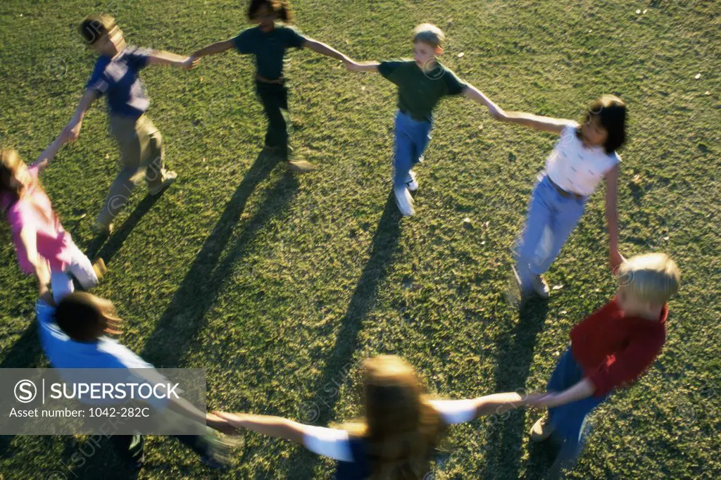 High angle view of a group of children playing on a lawn