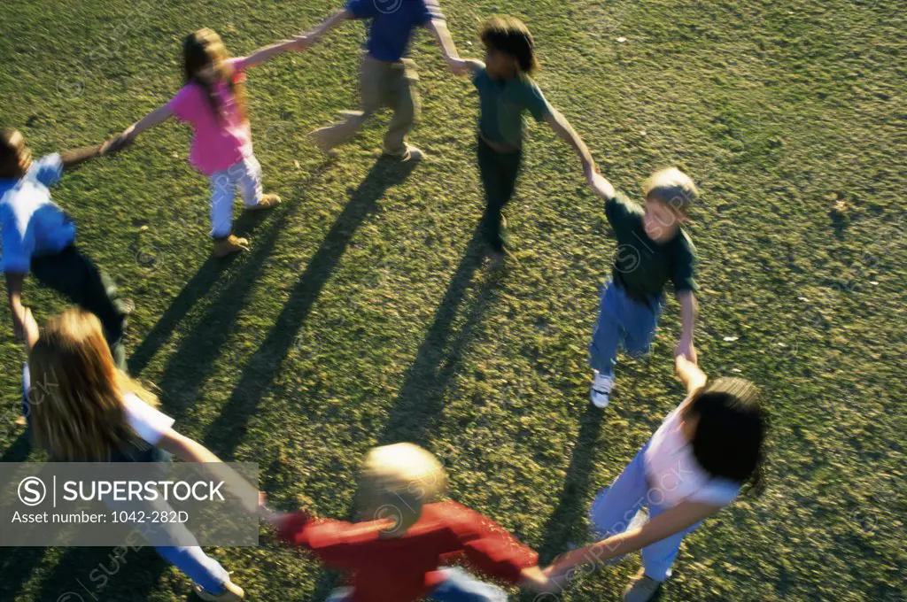 High angle view of a group of children playing on a lawn