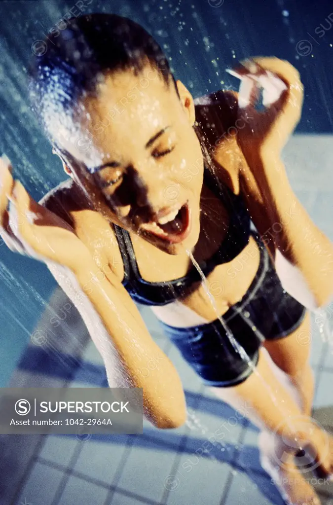 Young woman taking a shower