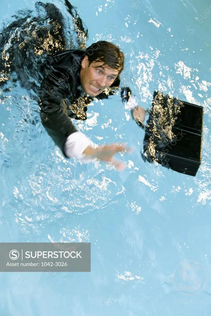 Businessman in water with a briefcase