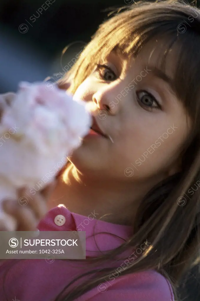 Close-up of a girl looking at an ice cream cone