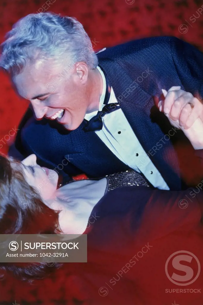 Close-up of a mid adult couple dancing