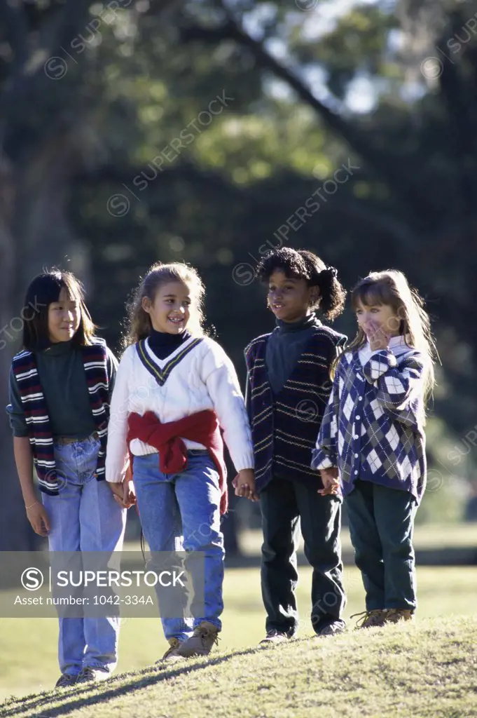 Group of girls standing together on a lawn